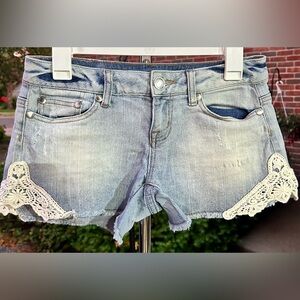 Maurices Jean shorts with lace on bottom.